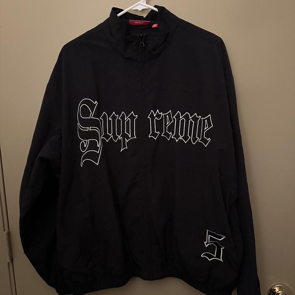 Supreme Black Jacket with Red Tag